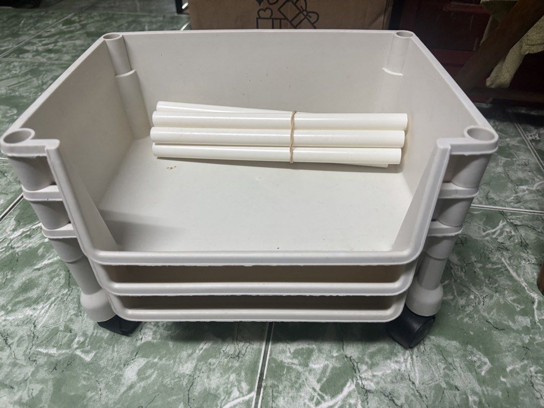 Plastic Stackable Storage Baskets Trolley with Wheels (Category: Storage Boxes & Baskets) located in Las Pinas. Submitted by nekomeow22 (Listing ID 1468553230, Image 1). Description: - 3-tier plastic storage basket set in a stylish cream white color - Includes 4 support poles and 4 smooth-rolling caster wheels for mobility - Open front design allows quick and easy access to your items - Modular construction lets you securely stack and customize t