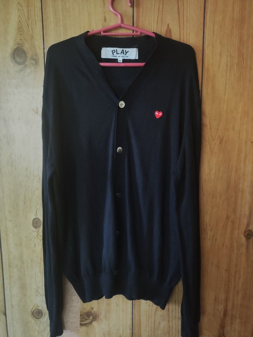 PLAY CDG Cardigan (Category: Coats, Jackets and Outerwear) located in Romblon. Submitted by teppthrift. (Listing ID 1468513280, Image 1). Description: - Brand: PLAY Comme des Garçons - Item: Black Knit Cardigan - Size: M 24x29 - Material: 100% Cotton, Made in Japan - Authentic - Detail: Iconic embroidered small red heart logo on the chest - Collection / Style Code: AD2016 / AZ-N054 - Condition: Excellent pre-loved condition - Perfect for smart-ca