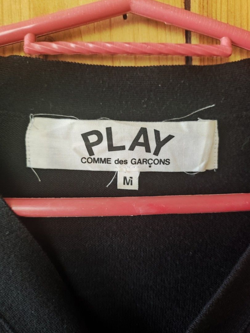 PLAY CDG Cardigan (Category: Coats, Jackets and Outerwear) located in Romblon. Submitted by teppthrift. (Listing ID 1468513280, Image 3). Description: - Brand: PLAY Comme des Garçons - Item: Black Knit Cardigan - Size: M 24x29 - Material: 100% Cotton, Made in Japan - Authentic - Detail: Iconic embroidered small red heart logo on the chest - Collection / Style Code: AD2016 / AZ-N054 - Condition: Excellent pre-loved condition - Perfect for smart-ca