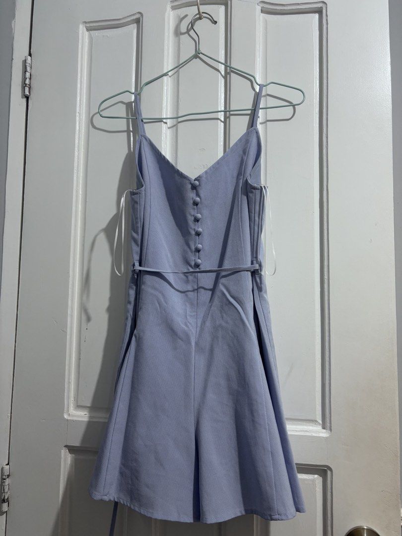 PLAYDRESS ROMPER Light blue (Category: Rompers) located in Manila. Submitted by vintage_wonder8 (Listing ID 1468691911, Image 2). Description: - Playdress, Bought this in singapore last year - Color & Pattern: Light blue with a subtle checkered pattern - Design: Thin straps, front decorative fabric buttons, and flared shorts - Features: Includes side pockets and a matching thin tie belt for a flattering waistline - Comfort: Easy to slip on and co