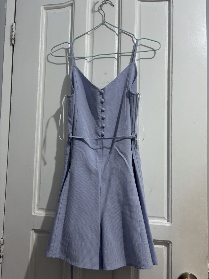 PLAYDRESS ROMPER Light blue (Category: Rompers) located in Manila. Submitted by vintage_wonder8 (Listing ID 1468691911, Image 1). Description: - Playdress, Bought this in singapore last year - Color & Pattern: Light blue with a subtle checkered pattern - Design: Thin straps, front decorative fabric buttons, and flared shorts - Features: Includes side pockets and a matching thin tie belt for a flattering waistline - Comfort: Easy to slip on and co