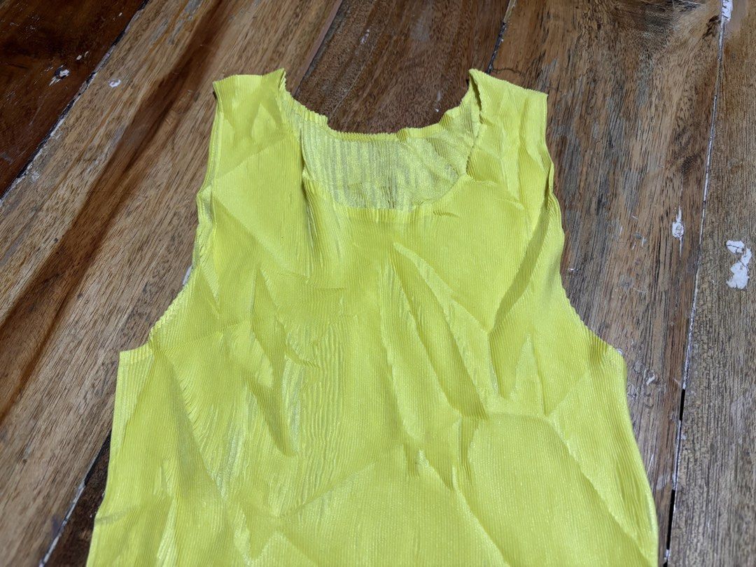Pleats please neon yellow sleeveless (Category: Sleeveless) located in Cagayan de Oro. Submitted by kirkwax_4 (Listing ID 1468602234, Image 2). Description: Pleats please neon yellow sleeveless Small frame (stretchy) Like new No issue 2680.