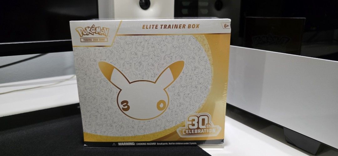 Pokémon 30th Celebration Elite Trainer Box (ETB) English (Category: Card Boxes & Cases) located in San Juan City. Submitted by SoleTech_Manila (Listing ID 1468520308, Image 1). Description: - Brand new and 100% factory-sealed Pokémon 30th Celebration Elite Trainer Box - Includes 9 Pokémon TCG booster packs to open or keep sealed - Features a full-art foil promo card featuring Nidorina - Comes with 16 foil basic energy cards and 65 card sleeves - 