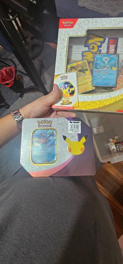 Pokémon 30th Tin English (Category: Card Boxes & Cases) located in Manila. Submitted by anthonylee23810 (Listing ID 1468544229, Image 1). Description: - Item: Sealed Pokémon Celebrations Mini Tin (Greninja) - Condition: Brand new, factory sealed, and in pristine condition - Features: Iconic 25th-anniversary branding with booster packs inside - Ideal for: Serious TCG collectors, players, and Pokémon fans - Shipping or Meet-up: Ships securely or av