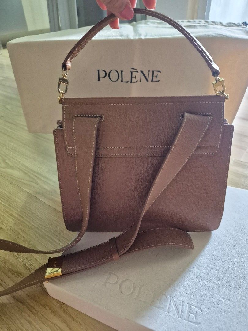 Polène structured leather shoulder bag in tan with box (Category: Luxury Bags & Wallets) located in Makati City. Submitted by beautiful_jj (Listing ID 1468562703, Image 3). Description: - Brand: Polene - Color: Rich Tan - Material: Premium leather with luxurious suede lining - Design: Structured square flap with secure gold-tone hardware clasp and engraved logo - Strap: Adjustable shoulder strap featuring a gold metal keeper - Interior: Organized