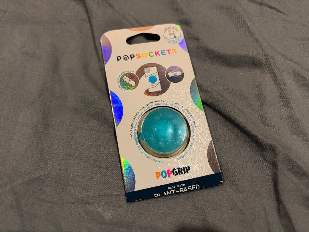PopSockets PopGrip Plant-Based Purple Iridescent (Category: Cases & Sleeves) located in Marikina City. Submitted by nj1989 (Listing ID 1468569792, Image 2). Description: Flaws: Few scratches on pop top - Made from eco-friendly plant-based material - Beautiful purple iridescent finish with a subtle color shift - Swappable top design so you can change up your style anytime - Versatile design functions as both a secure phone grip and a convenient st