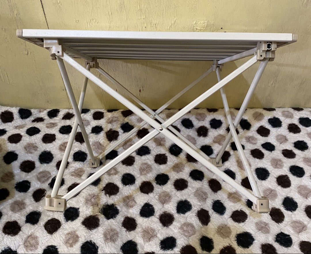 Portable Foldable Camping Table Aluminium Slat Top (Category: Hiking & Camping) located in Baguio. Submitted by thrift_bonita (Listing ID 1468553115, Image 3). Description: - Compact folding table with roll-up slat top and X-frame metal legs - Lightweight, easy to set up, and packs down small - Ideal for camping trips, picnics, or outdoor markets - Neutral beige and white color scheme matches most outdoor gear - Sturdy and durable construction.
