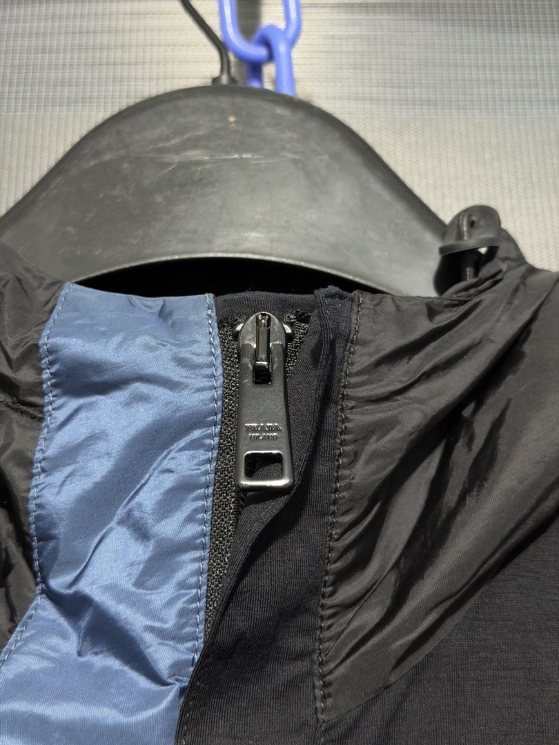 Prada black zip-up nylon jacket (Category: Coats, Jackets and Outerwear) located in Calumpit. Submitted by Essentiality (Listing ID 1468644824, Image 3). Description: Prada black zip-up nylon jacket 21x26.5 ₱2,500.
