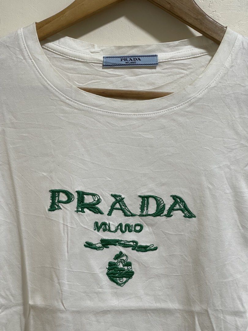 Prada milano shirt size S (Category: Luxury Apparel) located in Marikina City. Submitted by joshuaades21107 (Listing ID 1468672083, Image 2). Description: Prada Complete tags Small 19 width 23 length Embroidered design Need wash, may minimal stain check photos for reference.