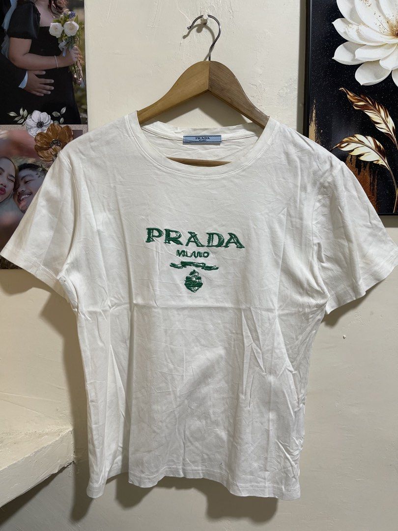 Prada milano shirt size S (Category: Luxury Apparel) located in Marikina City. Submitted by joshuaades21107 (Listing ID 1468672083, Image 1). Description: Prada Complete tags Small 19 width 23 length Embroidered design Need wash, may minimal stain check photos for reference.