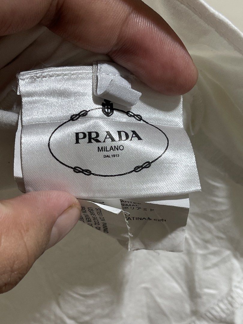 Prada milano shirt size S (Category: Luxury Apparel) located in Marikina City. Submitted by joshuaades21107 (Listing ID 1468672083, Image 3). Description: Prada Complete tags Small 19 width 23 length Embroidered design Need wash, may minimal stain check photos for reference.