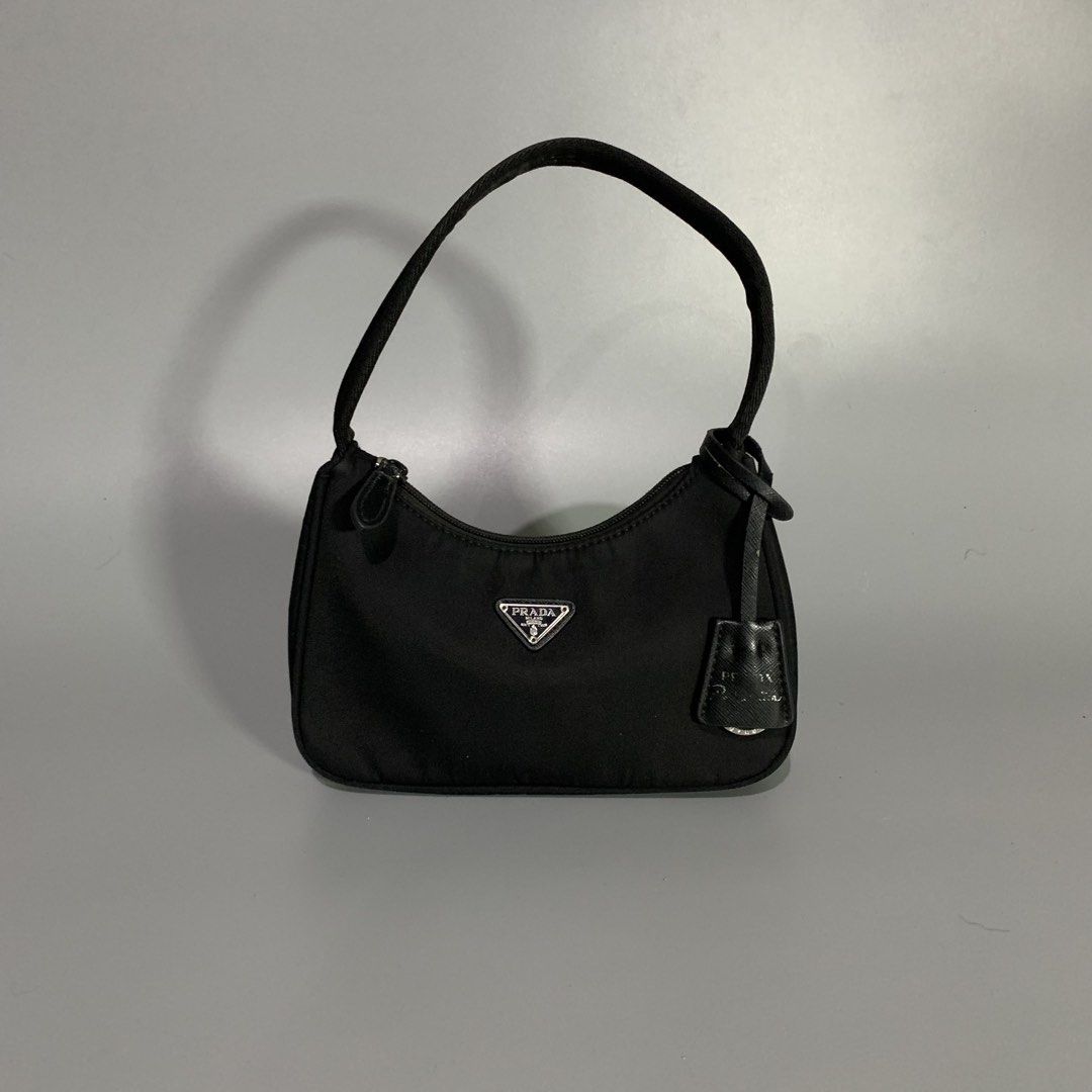Prada Re-Edition Black Tessuto Nylon Mini Bag (Category: Luxury Bags & Wallets) located in Davao. Submitted by jandyfuert21303 (Listing ID 1468654053, Image 1). Description: •Excellent condition •ykk underzip •Have minor issue on puller •Check details •So pretty in person .