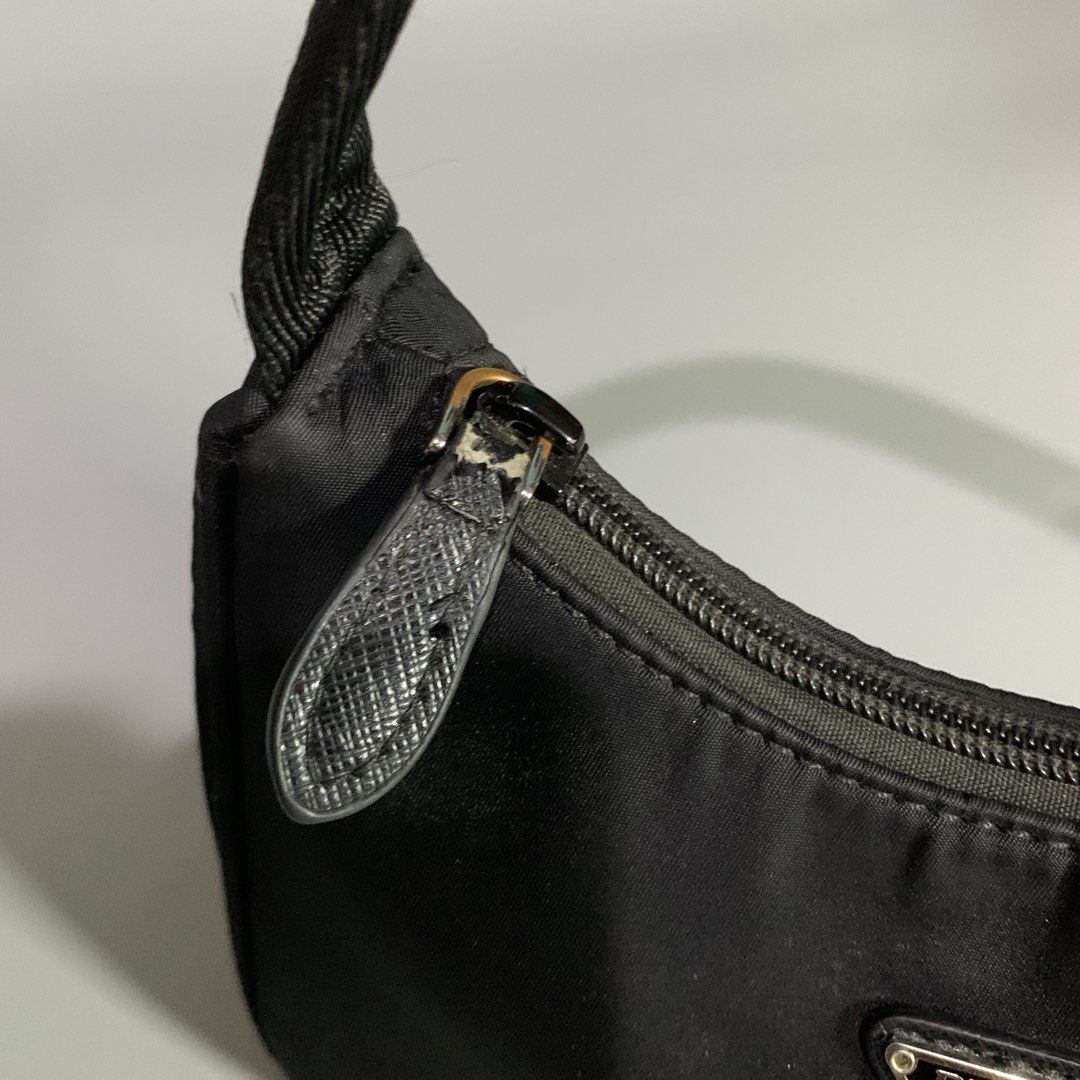 Prada Re-Edition Black Tessuto Nylon Mini Bag (Category: Luxury Bags & Wallets) located in Davao. Submitted by jandyfuert21303 (Listing ID 1468654053, Image 3). Description: •Excellent condition •ykk underzip •Have minor issue on puller •Check details •So pretty in person .