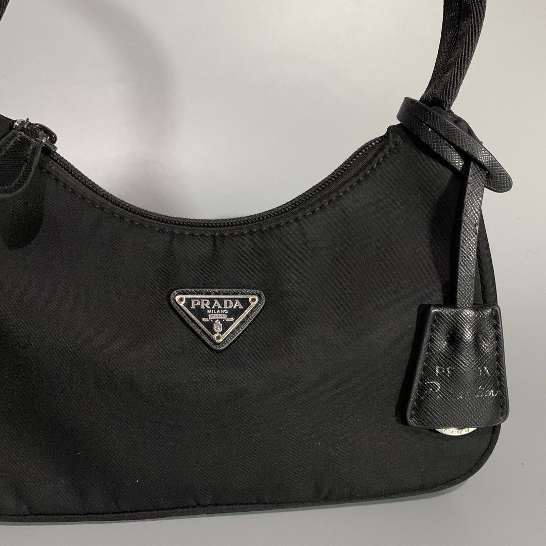 Prada Re-Edition Black Tessuto Nylon Mini Bag (Category: Luxury Bags & Wallets) located in Davao. Submitted by jandyfuert21303 (Listing ID 1468654053, Image 2). Description: •Excellent condition •ykk underzip •Have minor issue on puller •Check details •So pretty in person .