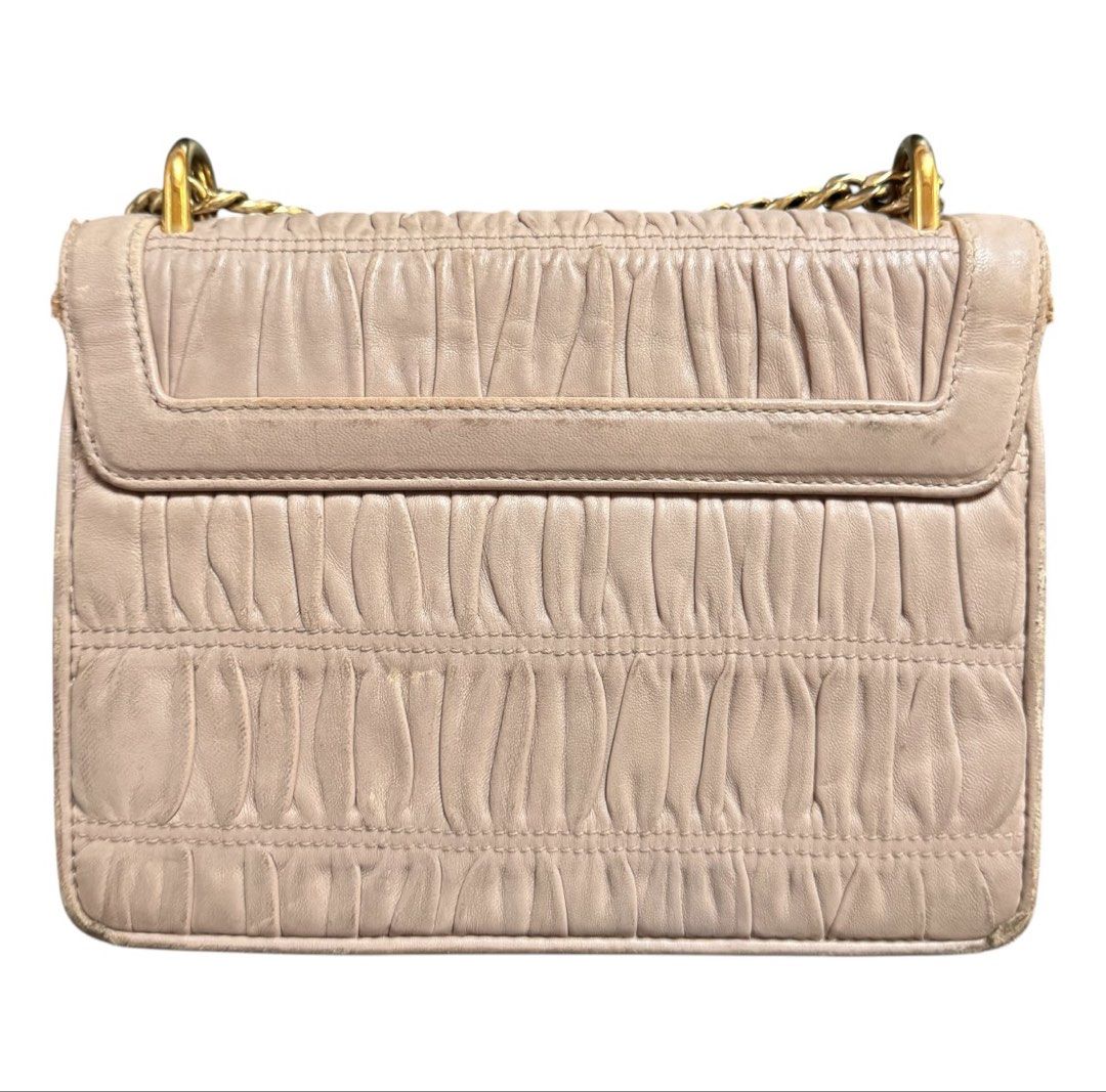 Prada Shoulder Bag (Category: Shoulder Bags) located in Baguio. Submitted by pwz-eshop (Listing ID 1468567055, Image 3). Description: • Up for Grabs!! • Flaws: scuffs and rubs on leather. Tarnished hardware. (please see photos) • BRAND: PRADA. • DIMENSIONS: length 7.75", height 5.75", width 3", handle drop: 18". • SERIAL NUMBER: 165. • COUNTRY OF ORIGIN: Undetermined. • MATERIAL: Leather. • COLOR: Old rose. • Lining: Leather. • HARDWARE: Gold ton
