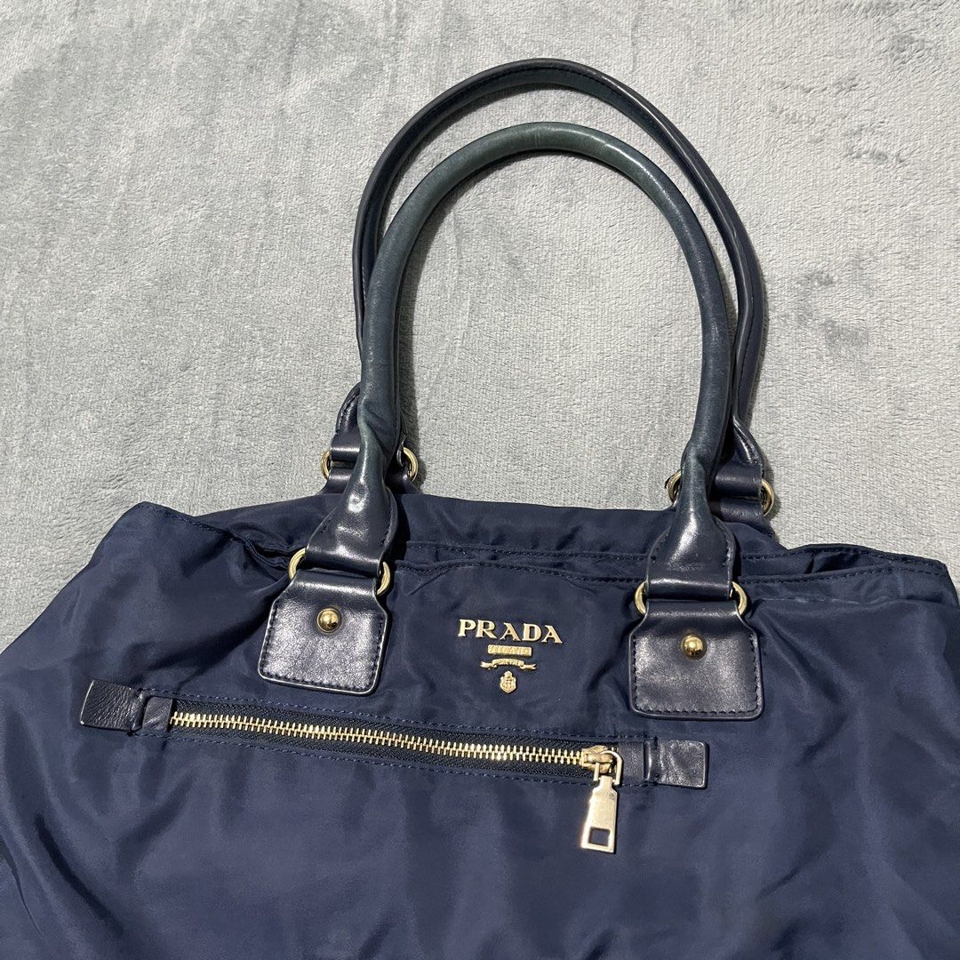 prada tessuto bag (Category: Luxury Bags & Wallets) located in Malay. Submitted by oplt_dept. (Listing ID 1468610805, Image 2). Description: -honest flaws(see pics) -luxury essentials -width:16 -length:10.5 .
