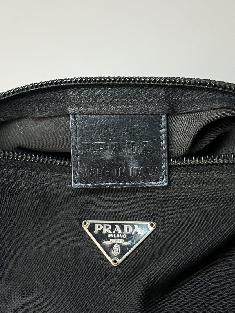 Prada Tessuto Nylon Cylindrical Pouch (Category: Luxury Accessories) located in Manila. Submitted by streetsavvy (Listing ID 1468589257, Image 3). Description: Prada Tessuto Nylon Cylindrical Pouch Width: 7” Height: 2.5” Depth: 3” Measured in Inches A classic vintage Prada piece crafted from signature black Tessuto technical nylon. Designed in a sleek, compact cylindrical silhouette, this versatile pouch works as a pencil case, travel cosmetic ba