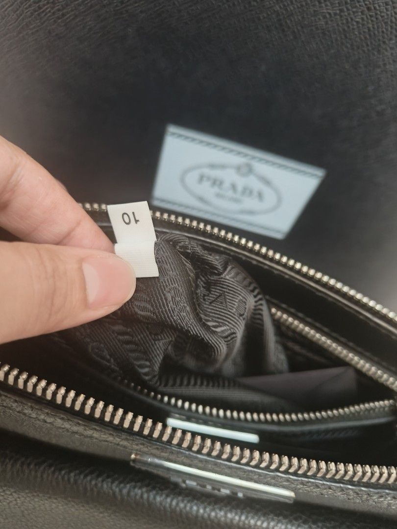 Pre owned Prada Toro Nero Black Leather Crossbody (Category: Sling Bags) located in Makati City. Submitted by emem.pre.owned.ph (Listing ID 1468545438, Image 3). Description: Prada Toro Nero Leather Crossbody Bag •Length: 10.0" (25 cm) •Height: 7.5" (19 cm) •Depth: 1.5" (3 cm) •Strap Drop: 24.0" (60 cm) •Detachable shoulder strap •Zip closure •One zip pocket, one slip pocket, six card slots •Leather •Nylon Lining •Silver Hardware •Made In: Italy 