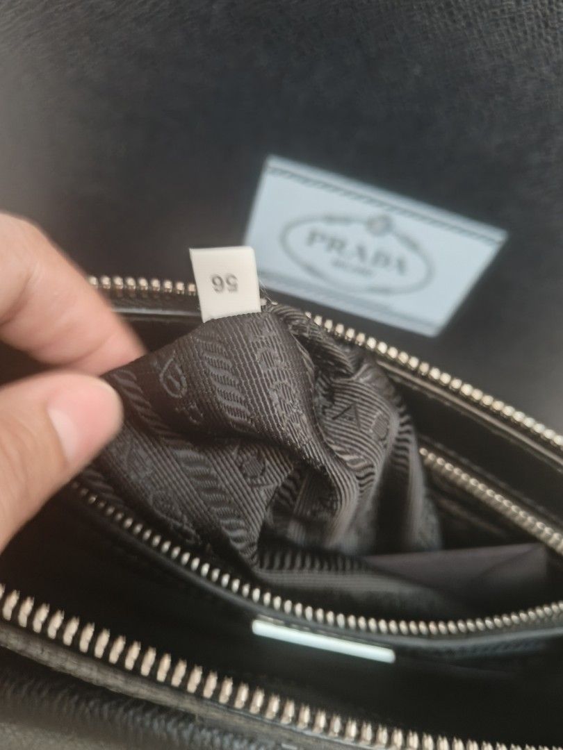 Pre owned Prada Toro Nero Black Leather Crossbody (Category: Sling Bags) located in Makati City. Submitted by emem.pre.owned.ph (Listing ID 1468545438, Image 2). Description: Prada Toro Nero Leather Crossbody Bag •Length: 10.0" (25 cm) •Height: 7.5" (19 cm) •Depth: 1.5" (3 cm) •Strap Drop: 24.0" (60 cm) •Detachable shoulder strap •Zip closure •One zip pocket, one slip pocket, six card slots •Leather •Nylon Lining •Silver Hardware •Made In: Italy 
