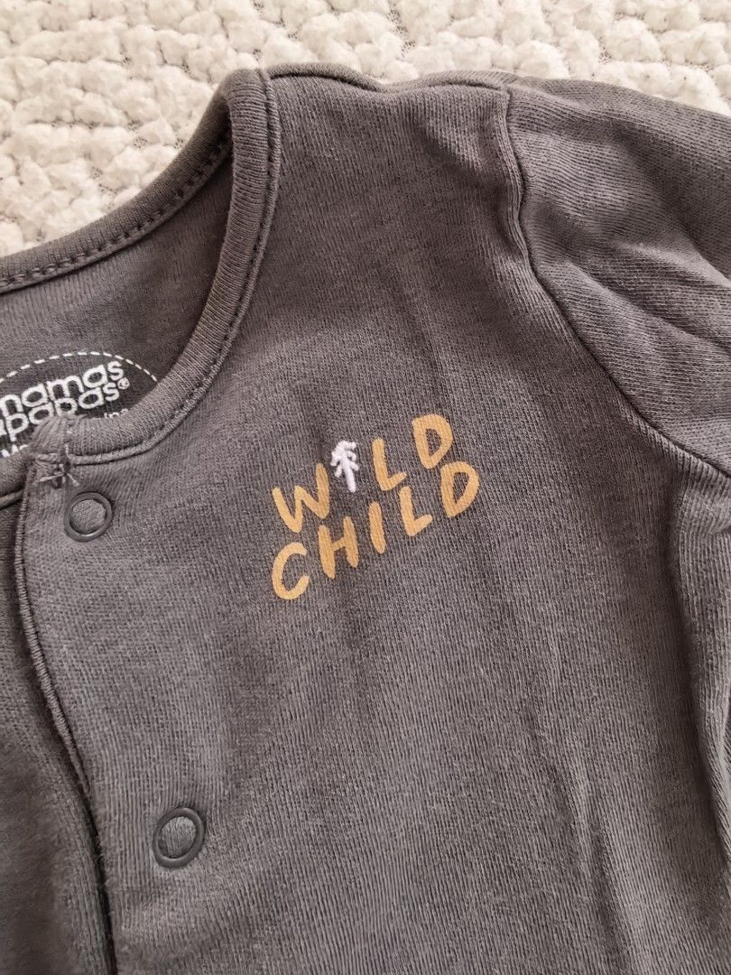 Preloved Mamas & Papas Newborn Footed Sleepsuits Bundle (Category: Babies & Kids Fashion) located in Manila. Submitted by euladelosr38638 (Listing ID 1468581911, Image 3). Description: - Brand: Mamas & Papas - Size: Newborn - Designs: Heather grey raccoon print, burnt orange striped, and dark grey 'wild child' embroidered - Material: Super soft cotton for daily comfort - Features: Convenient front snap button closures for quick diaper changes Can