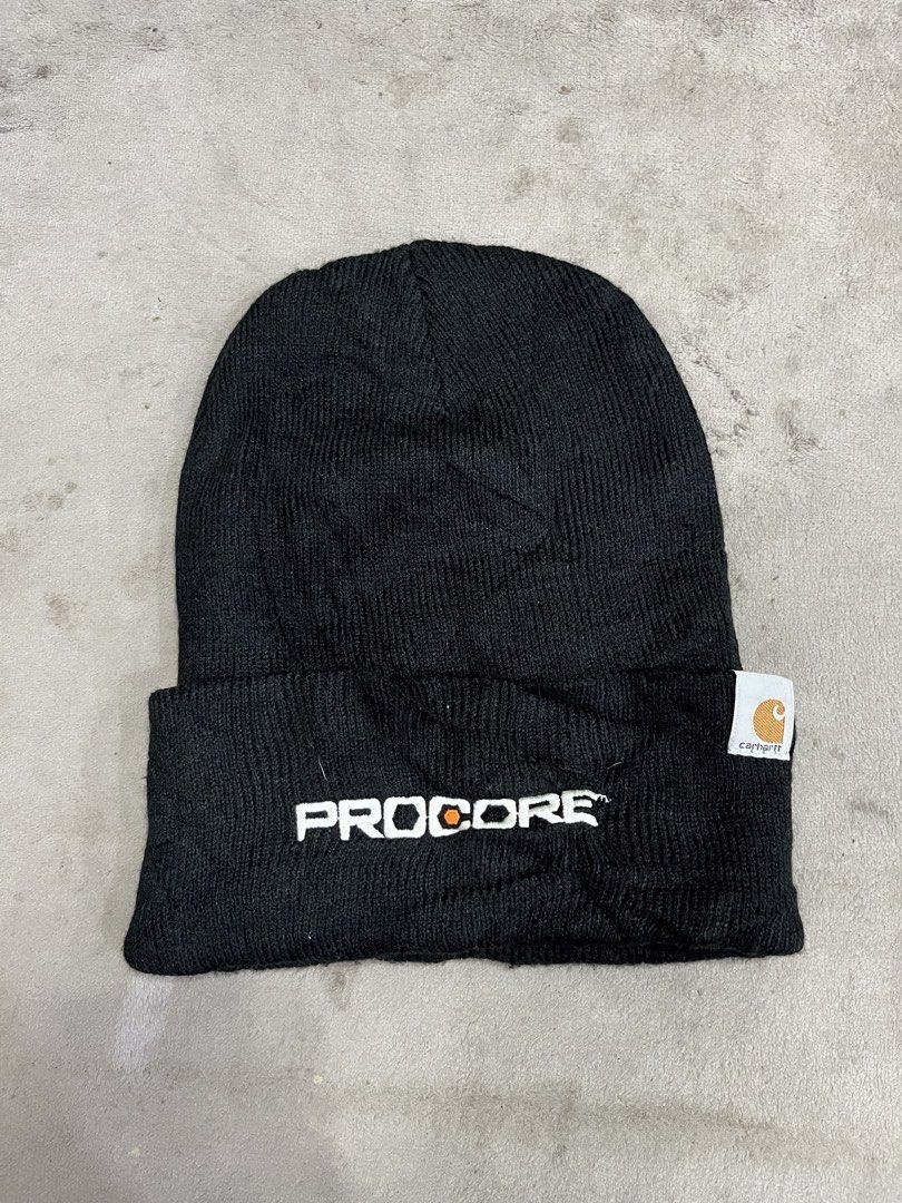 Procore Carhartt Knit Cuffed Beanie (Category: Beanies) located in General Trias. Submitted by zrchustle.604 (Listing ID 1468593091, Image 1). Description: Procore Carhartt Knit Cuffed Beanie, which is an officially branded promotional workwear accessory. Key Details & Features: • Base Apparel: It uses the iconic Carhartt A18 Acrylic Watch Hat design, featuring a 100% acrylic rib-knit construction with a fold-up cuff. • Branding: It is customized