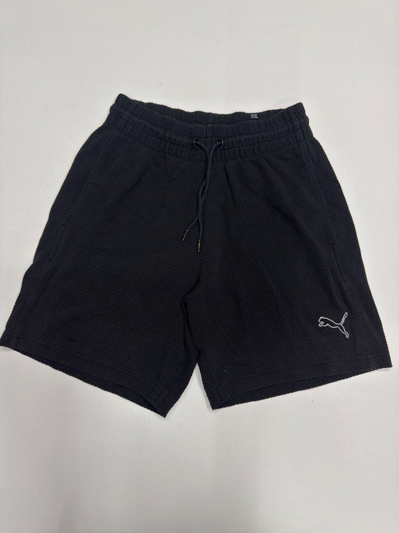 Puma Black Waffle Knit Shorts Size S (Category: Shorts) located in Bustos. Submitted by thenlnclot60500 (Listing ID 1468574765, Image 1). Description: - Brand: Puma - Color: Classic Black - Size: Small - Material: Textured waffle knit fabric - Features: Drawstring waistband with branded metal aglets, embroidered white Puma logo on the left leg, and two functional side pockets - Condition: Clean, well-maintained, and ready to wear.