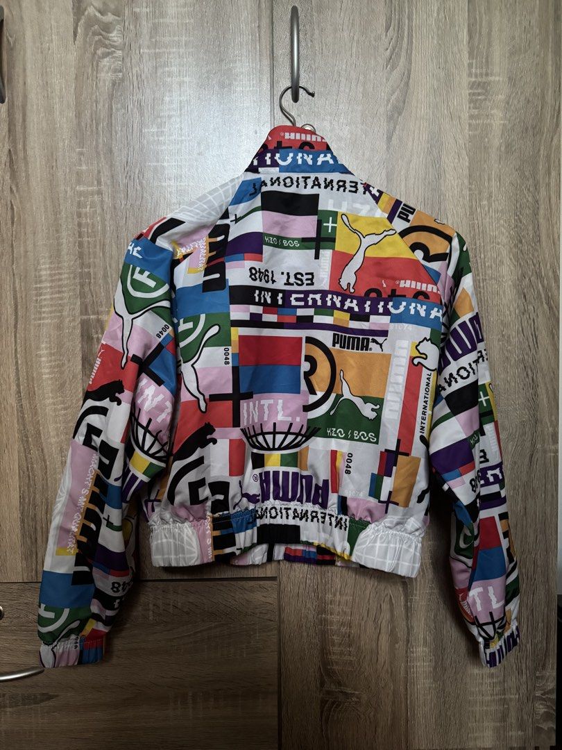 PUMA International Lab Track Jacket Multicolor (Category: Coats, Jackets and Outerwear) located in Mandaluyong City. Submitted by closetrewindbyalthea (Listing ID 1468565764, Image 2). Description: Full zip closure, high collar, ribbed cuffs and hem Lightweight XS (tag on inside collar) Clean and well-maintained.