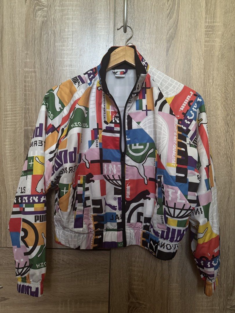 PUMA International Lab Track Jacket Multicolor (Category: Coats, Jackets and Outerwear) located in Mandaluyong City. Submitted by closetrewindbyalthea (Listing ID 1468565764, Image 1). Description: Full zip closure, high collar, ribbed cuffs and hem Lightweight XS (tag on inside collar) Clean and well-maintained.