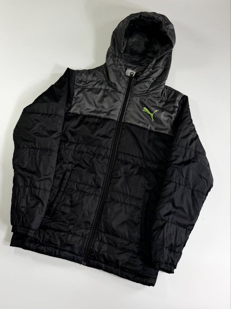 PUMA PUFFER (Category: Coats, Jackets and Outerwear) located in Valenzuela. Submitted by veriez_gems (Listing ID 1468624332, Image 2). Description: Brand: Puma Size: Medium (M) Style / Type: Puffer / Quilted hooded jacket with a full-zip front and attached hood Colorway: Two-tone black and dark grey body with a bright lime/neon green embroidered Puma cat logo on the chest Features: Quilted insulated design for warmth Full-length front zipper Dual