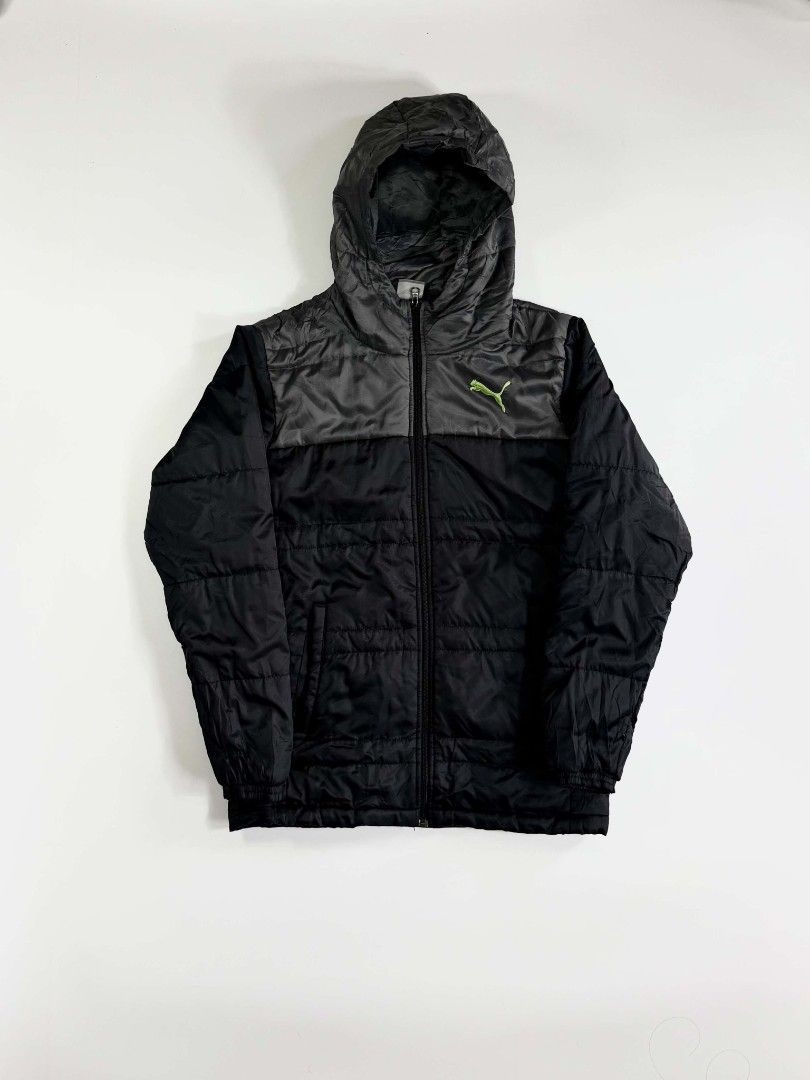 PUMA PUFFER (Category: Coats, Jackets and Outerwear) located in Valenzuela. Submitted by veriez_gems (Listing ID 1468624332, Image 1). Description: Brand: Puma Size: Medium (M) Style / Type: Puffer / Quilted hooded jacket with a full-zip front and attached hood Colorway: Two-tone black and dark grey body with a bright lime/neon green embroidered Puma cat logo on the chest Features: Quilted insulated design for warmth Full-length front zipper Dual