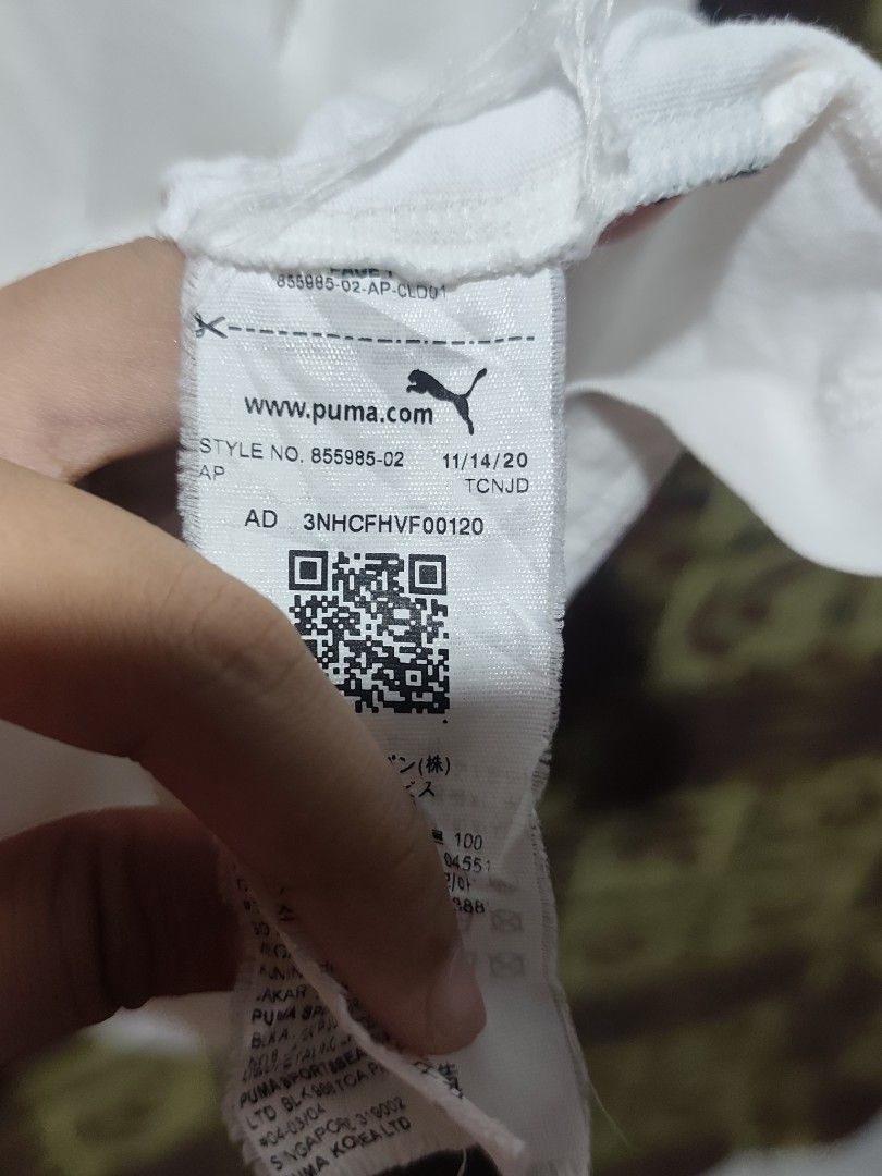 PUMA white shirt with logo (Category: Formal Shirts) located in Bauang. Submitted by chrisquinto2004 (Listing ID 1468523476, Image 3). Description: - Brand: PUMA - Color: White with black logo - Size: Large (Asia L) - Features: Classic chest logo and branded sleeve cuffs - Condition: Good pre-owned condition, clean and well-kept - Style: Casual / Athletic wear.