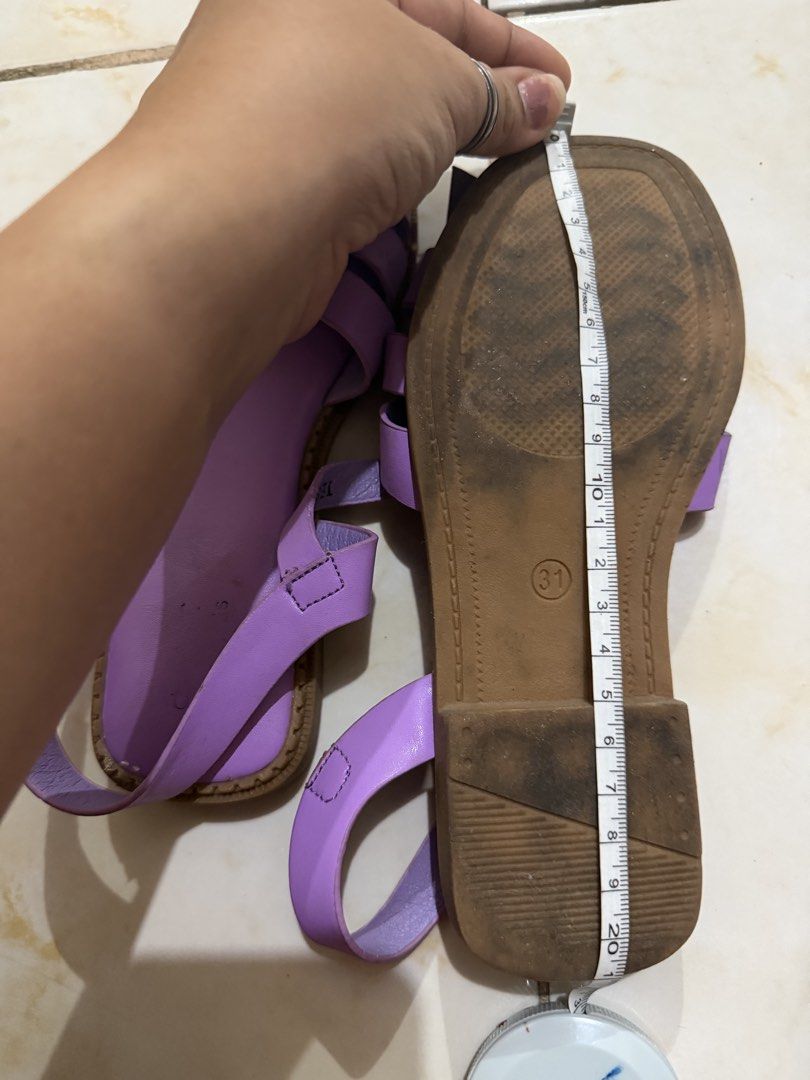 Purple Gladiator Strappy Flat Sandals Size 31 (Category: Flats & Sandals) located in Taguig. Submitted by heideewatts (Listing ID 1468617983, Image 2). Description: - Color: Bright purple - Size: 31 (stamped on sole and inner strap) 21cm outside size - Style: Strappy sandals with flat soles, minimal heel, and ankle buckle closure - Condition: Worn a few times, soles show normal signs of wear/dirt - Perfect fun pop of color for warm weather outfit