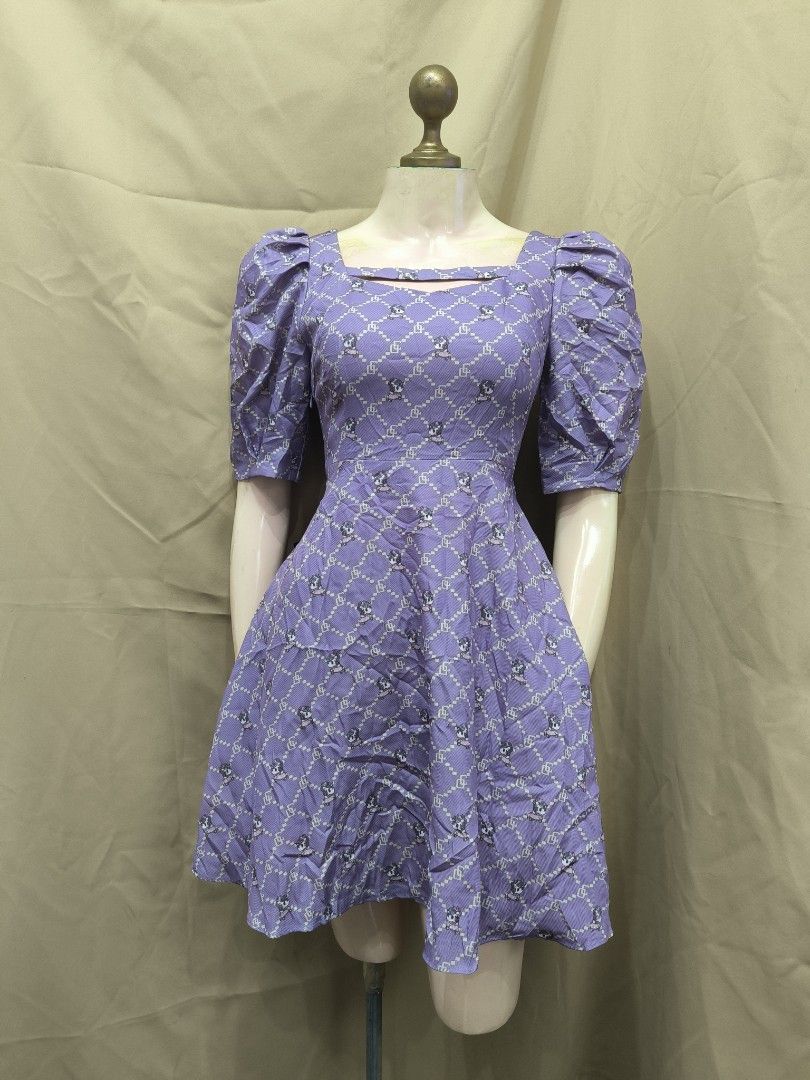 Purple Patterned Square Neck Puff Sleeve Dress (Category: Dresses) located in Marikina City. Submitted by mrlfashion23 (Listing ID 1468594193, Image 1). Description: - Color & Pattern: Purple with all-over geometric print and cute small characters - Neckline: Square neck with a stylish cutout detail near the collarbone - Sleeves: Short puff sleeves with gathered shoulders - Fit: Fitted bodice with a flattering flared A-line skirt - Material: Ligh