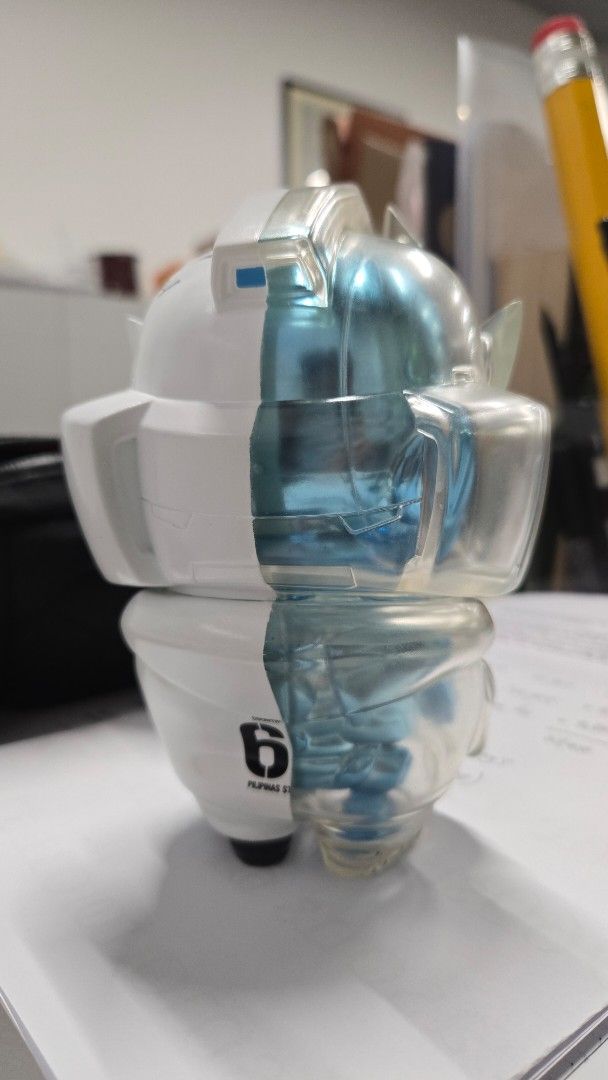 Quiccs CoreTeq NanoTeq (6") (Category: Designer & Blind Box Toys) located in Quezon City. Submitted by mrtenor (Listing ID 1468596329, Image 3). Description: - Authentic Bullet Punk Quiccs collectible figure -6 " - Colorway: White and translucent blue with signature helmet and clear outer suit - Signed on the back in black marker with year 2024 - Stands upright on feet - Condition: Clean, carefully displayed - Ideal for art toy and designer colle