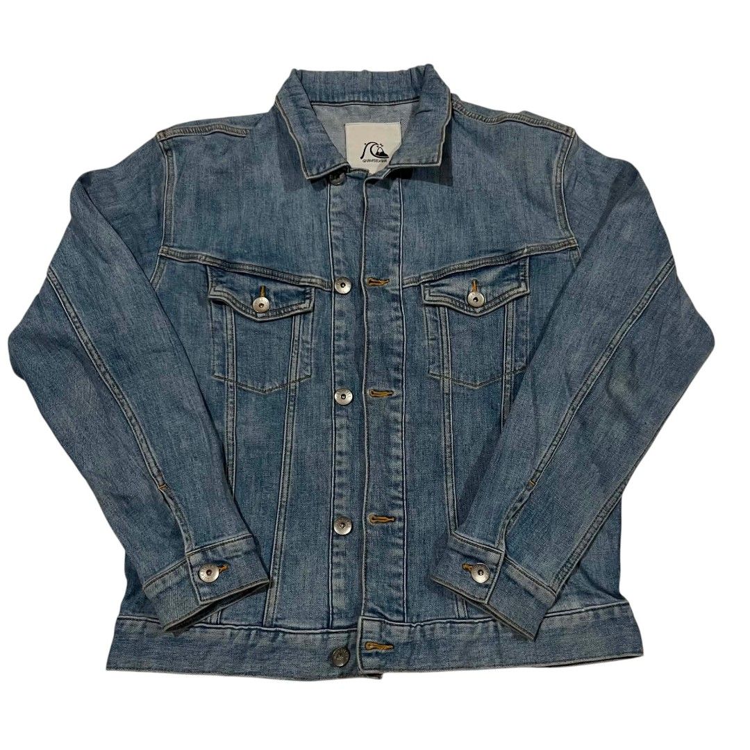 Quiksilver Blue Denim Jacket (Category: Coats, Jackets and Outerwear) located in Cagayan de Oro. Submitted by lootfindzzzz (Listing ID 1468617332, Image 1). Description: - Brand: Quiksilver - Color: Classic blue wash - Design: Button-up front with metal hardware, standard collar, and button cuffs - Pockets: Two functional chest flap pockets - Fit: True to size, great for layering over tees and hoodies - Condition: Excellent.