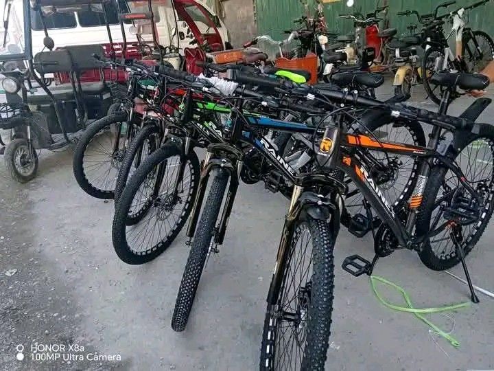 Raines Mountain Bike Black Orange (Category: Bicycles) located in Manila. Submitted by jayrinetoys2123 (Listing ID 1468541026, Image 3). Description: - Brand/Model: Raines Mountain Bike - Color: Black frame with orange and white graphics - Brakes: Reliable dual disc brakes - Suspension: Front suspension fork for smooth rides - Gearing: Multi-speed drivetrain for various terrains - Extras: Adjustable comfortable saddle and front/rear mudguards inc