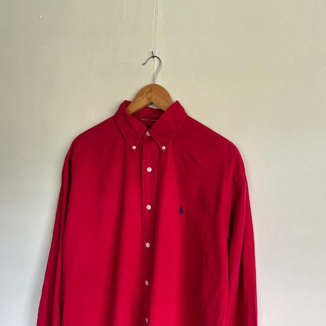 Ralph Lauren Blaire Red Button-Up Shirt Medium (Category: Tshirts & Polo Shirts ) located in San Fernando. Submitted by younglei (Listing ID 1468553278, Image 1). Description: - Brand: Ralph Lauren (Blaire model) - Color: Bright Red - Size: Medium (M) -Dimes: 24” width by 28” length - Material: 100% breathable cotton - Details: Classic collar, front button closure, iconic embroidered polo player logo on chest - Care: Machine washable - Condition:
