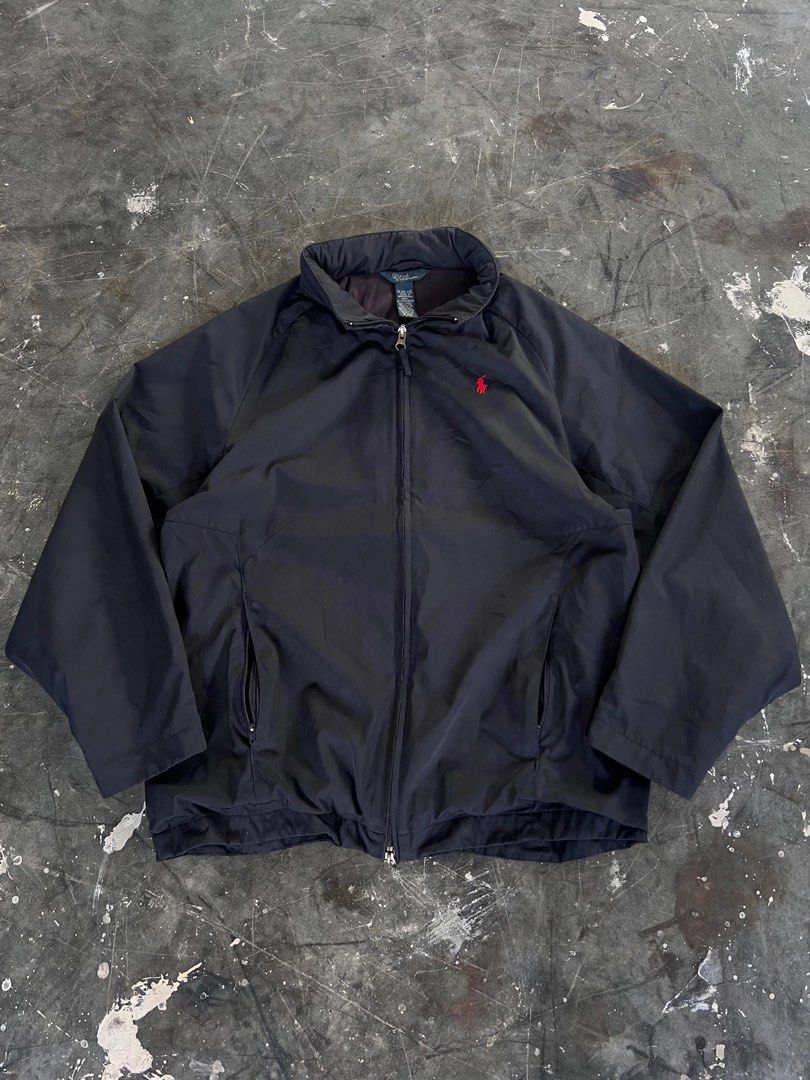 Ralph Lauren Jacket (Category: Coats, Jackets and Outerwear) located in Manila. Submitted by thrifttolive (Listing ID 1451594001, Image 1). Description: - Classic black jacket from Polo Ralph Lauren - Features the iconic red pony logo on the chest - Zip-up front with convenient pockets - Versatile for layering or wearing solo - Ideal for everyday casual wear.