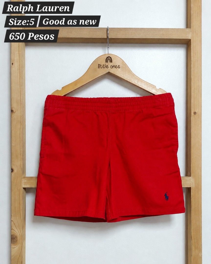 Ralph Lauren Red Shorts Size 5 (Category: Babies & Kids Fashion) located in Caloocan City. Submitted by clairyyyyy (Listing ID 1468665145, Image 1). Description: - Brand: Ralph Lauren - Color: Bright red with navy blue embroidered polo logo - Size: Kids Size 5 - Features: Comfortable elastic waistband, clean fabric - Condition: Excellent, clean throughout - Perfect for: Casual days out and active play.