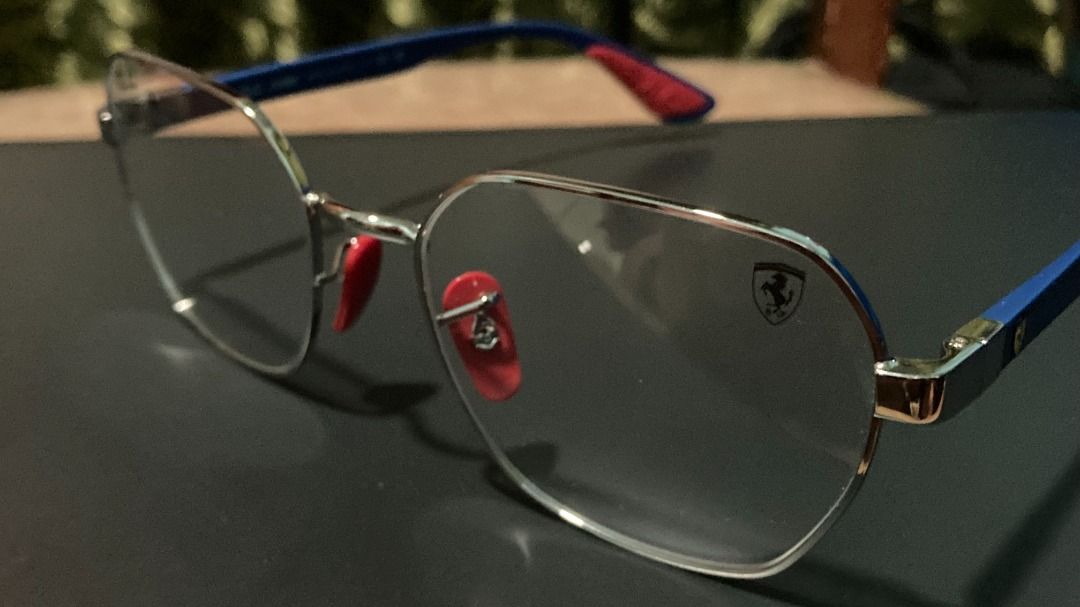 Ray-Ban Ferrari (Category: Sunglasses & Eyewear) located in Santa Rosa. Submitted by mael_ (Listing ID 1468576854, Image 1). Description: - Authentic Ray-Ban x Ferrari collaboration optical frames - Made in Italy with an ultra-lightweight Liteforce design - Silver metal front paired with striking blue temples - Iconic red rubber nose pads and temple tips for extra grip and comfort - Features the signature Ferrari shield logo on the left lens and 