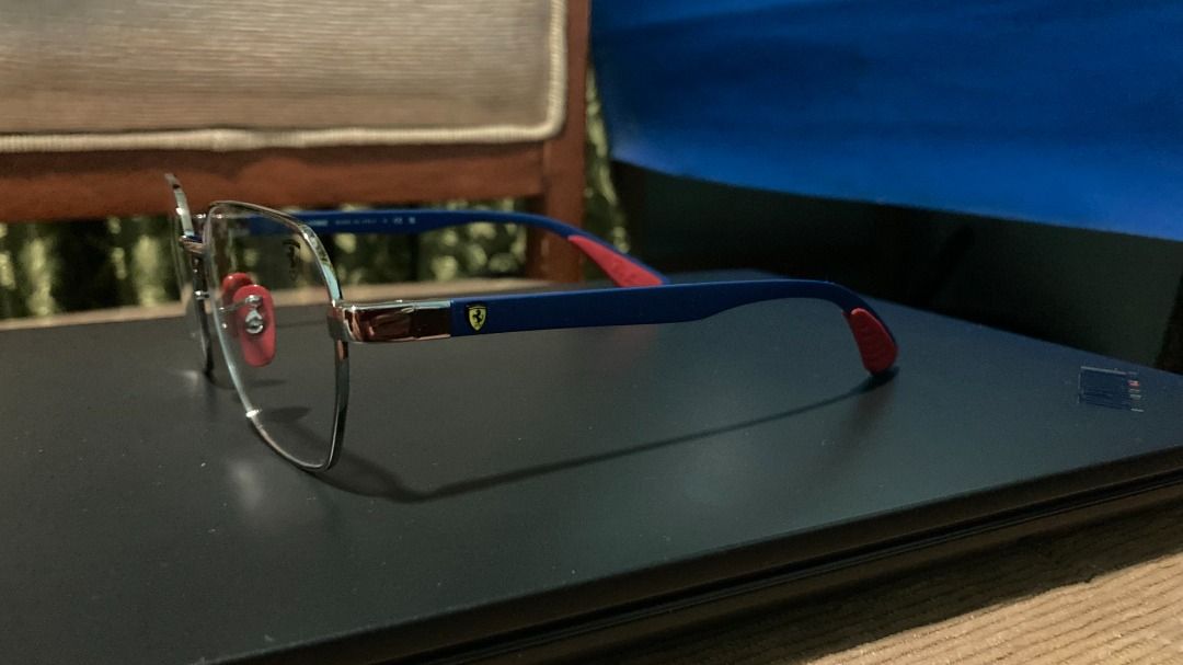 Ray-Ban Ferrari (Category: Sunglasses & Eyewear) located in Santa Rosa. Submitted by mael_ (Listing ID 1468576854, Image 3). Description: - Authentic Ray-Ban x Ferrari collaboration optical frames - Made in Italy with an ultra-lightweight Liteforce design - Silver metal front paired with striking blue temples - Iconic red rubber nose pads and temple tips for extra grip and comfort - Features the signature Ferrari shield logo on the left lens and 