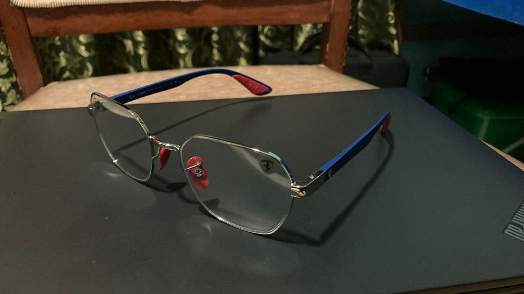 Ray-Ban Ferrari (Category: Sunglasses & Eyewear) located in Santa Rosa. Submitted by mael_ (Listing ID 1468576854, Image 2). Description: - Authentic Ray-Ban x Ferrari collaboration optical frames - Made in Italy with an ultra-lightweight Liteforce design - Silver metal front paired with striking blue temples - Iconic red rubber nose pads and temple tips for extra grip and comfort - Features the signature Ferrari shield logo on the left lens and 