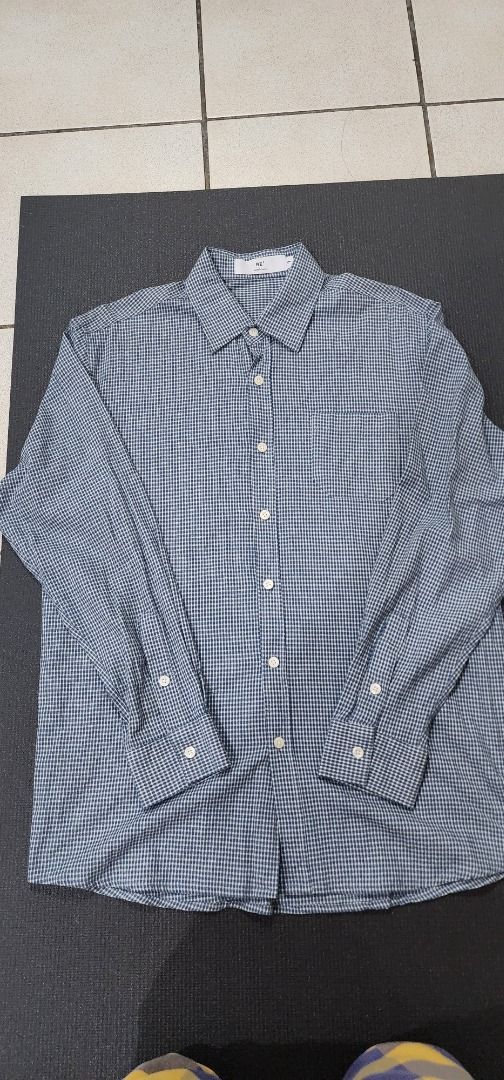 [RE'] Men's Blue Gingham Long Sleeve Button Up (Category: Formal Shirts) located in Manila. Submitted by bibimboop (Listing ID 1468548923, Image 1). Description: Also bought from S. Korea, used maybe 1-2 times. Just a bit wrinkly from a bad fold; the material is quite thin, and has a small front pocket. Shoulders: 17.5" Chest: 17" Length: 27.5" Sleeve length: 23.5" 🧧 Mode of Payment: Gcash or Cash (meet-ups) 📍 Meet-Ups: Robinsons Place Manila (