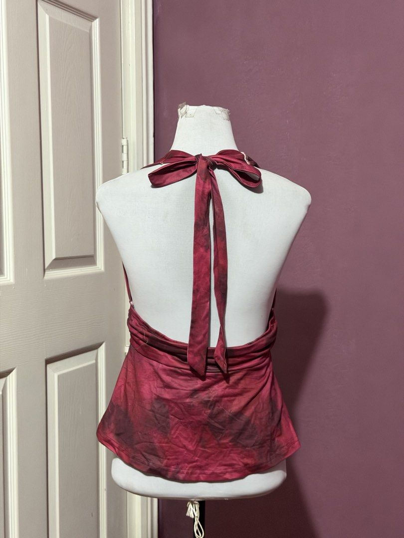 Red bday Halter Top Open Back Flowy Blouse (Category: Sleeveless) located in Manila. Submitted by thatgirl0001 (Listing ID 1468686777, Image 3). Description: - Color/Pattern: Red and dark patterned - Style: Halter top with open back and neck ties - Details: Flattering ruched waist band and flowy flared hem - Fabric: Lightweight and breathable, ideal for PH weather - Condition: Excellent (ready to wear) .