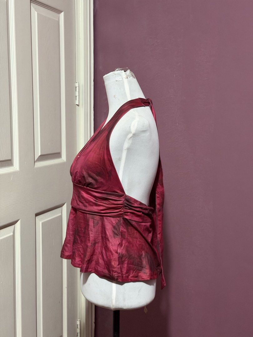 Red bday Halter Top Open Back Flowy Blouse (Category: Sleeveless) located in Manila. Submitted by thatgirl0001 (Listing ID 1468686777, Image 2). Description: - Color/Pattern: Red and dark patterned - Style: Halter top with open back and neck ties - Details: Flattering ruched waist band and flowy flared hem - Fabric: Lightweight and breathable, ideal for PH weather - Condition: Excellent (ready to wear) .