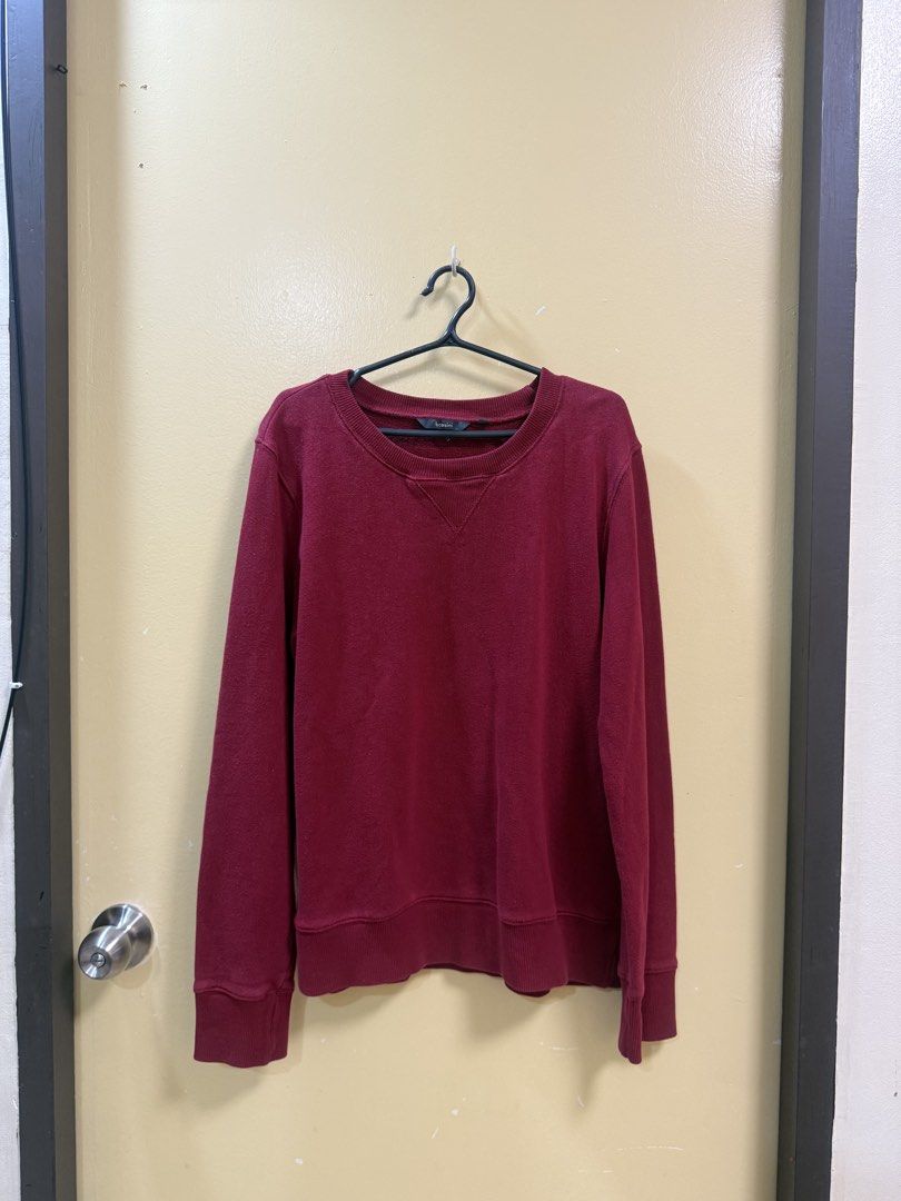 Red Bossini Sweatshirt (Category: Coats, Jackets and Outerwear) located in Makati City. Submitted by shoprory (Listing ID 1468591456, Image 1). Description: - Brand: Bossini - Color: Maroon - Style: Crewneck with classic triangle insert - Fit: Relaxed fit with long sleeves - Details: Ribbed collar, cuffs, and hem - Material: Warm and cozy, ideal for casual days or layering.
