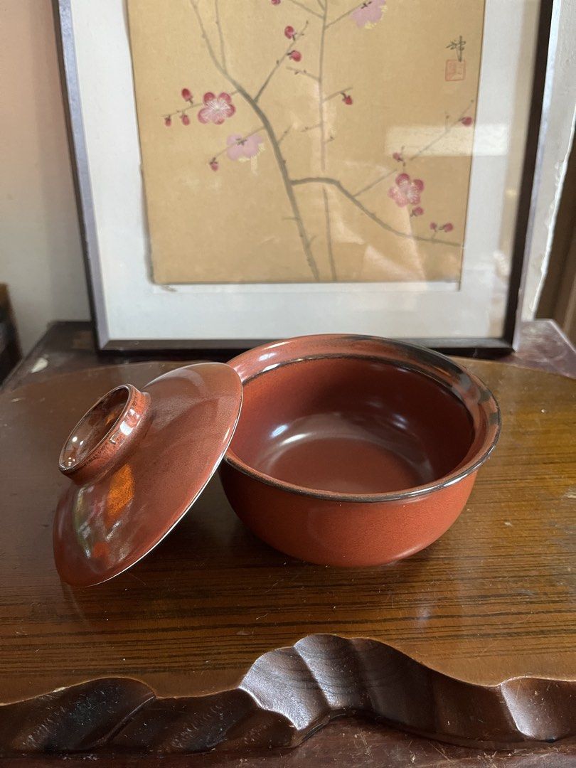Red Ceramic Bowl with Matching Lid (Category: Dinnerware & Cutlery) located in Taguig. Submitted by minmin_parker (Listing ID 1468535290, Image 1). Description: - Terracotta-toned ceramic bowl with matching lid - Smooth glossy glaze finish with stylish darker rim accents - Ideal size for individual portions of soup, rice, or steamed dishes - Easy to hand wash - Versatile design that matches various kitchen aesthetics.