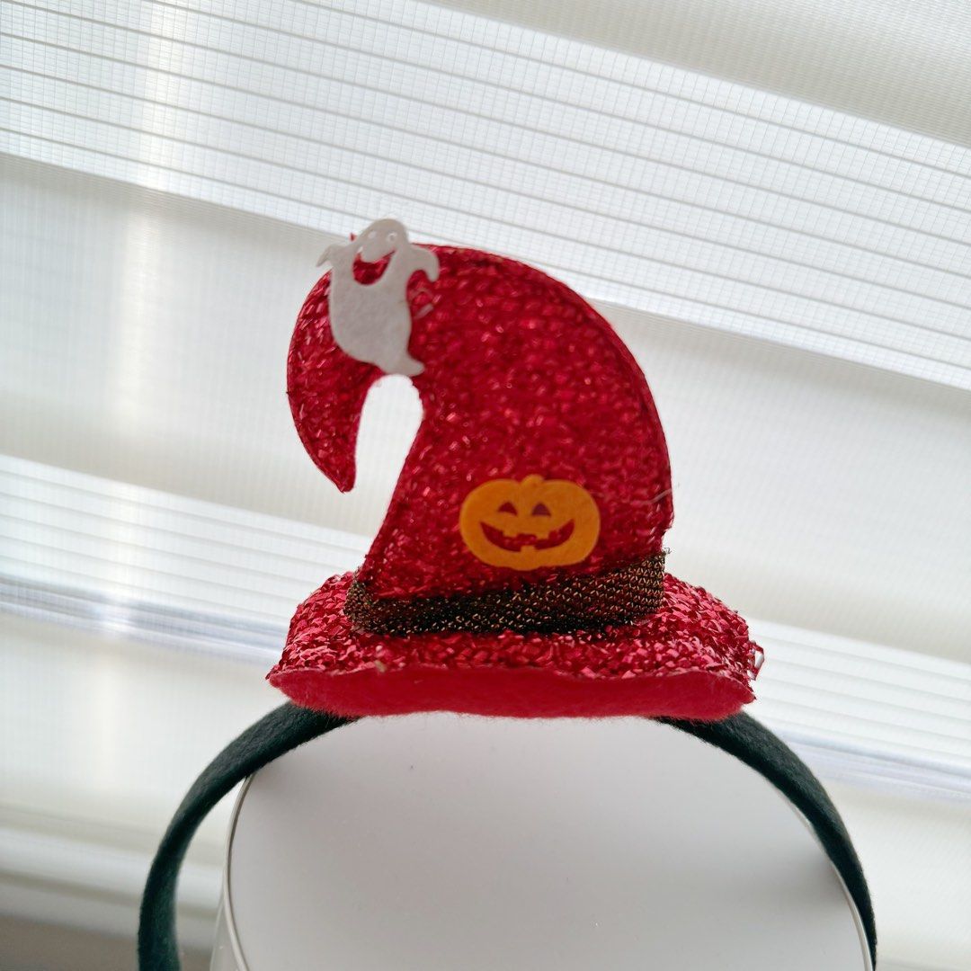 Red Halloween Witch Hat Headband with Pumpkin and Ghost (Category: Hair Accessories) located in Marikina City. Submitted by lovegoeson (Listing ID 1468544347, Image 2). Description: - Fun and festive Halloween headband for parties or trick-or-treating - Features a sparkly red witch hat with a gold sparkly band - Decorated with a cute orange pumpkin and a tiny white ghost - Comfortable black headband that fits most sizes - Perfect, hassle-free cos
