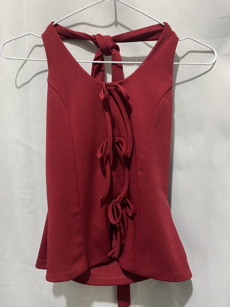 Red Halter Neck Tank Top with Cowl Back (Category: Sleeveless) located in Binangonan. Submitted by lovegenn (Listing ID 1468546089, Image 3). Description: - Color: Rich red - Design: Halter neck, sleeveless with delicate front ties - Back: Dramatic cowl drape with matching strap closure - Material: Soft and stretchy fabric for a flattering fit - Versatility: Great for nights out or casual weekends - Pairing: Easily matches with jeans or skirts.