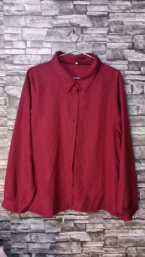 Red long sleeve button down collared blouse shirt (Category: Blouses) located in Antipolo. Submitted by reahespiritu (Listing ID 1468645354, Image 1). Description: - Color: Solid red - Fit: Relaxed fit, easy to tuck in or wear loose - Details: Classic button-down front, standard collar, button cuffs - Fabric: Lightweight with a slight sheen - Styling: Versatile piece perfect for both work and casual days.